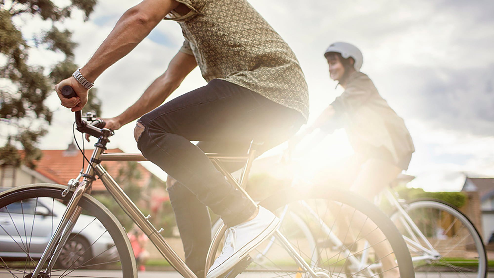Two people cycling on the road