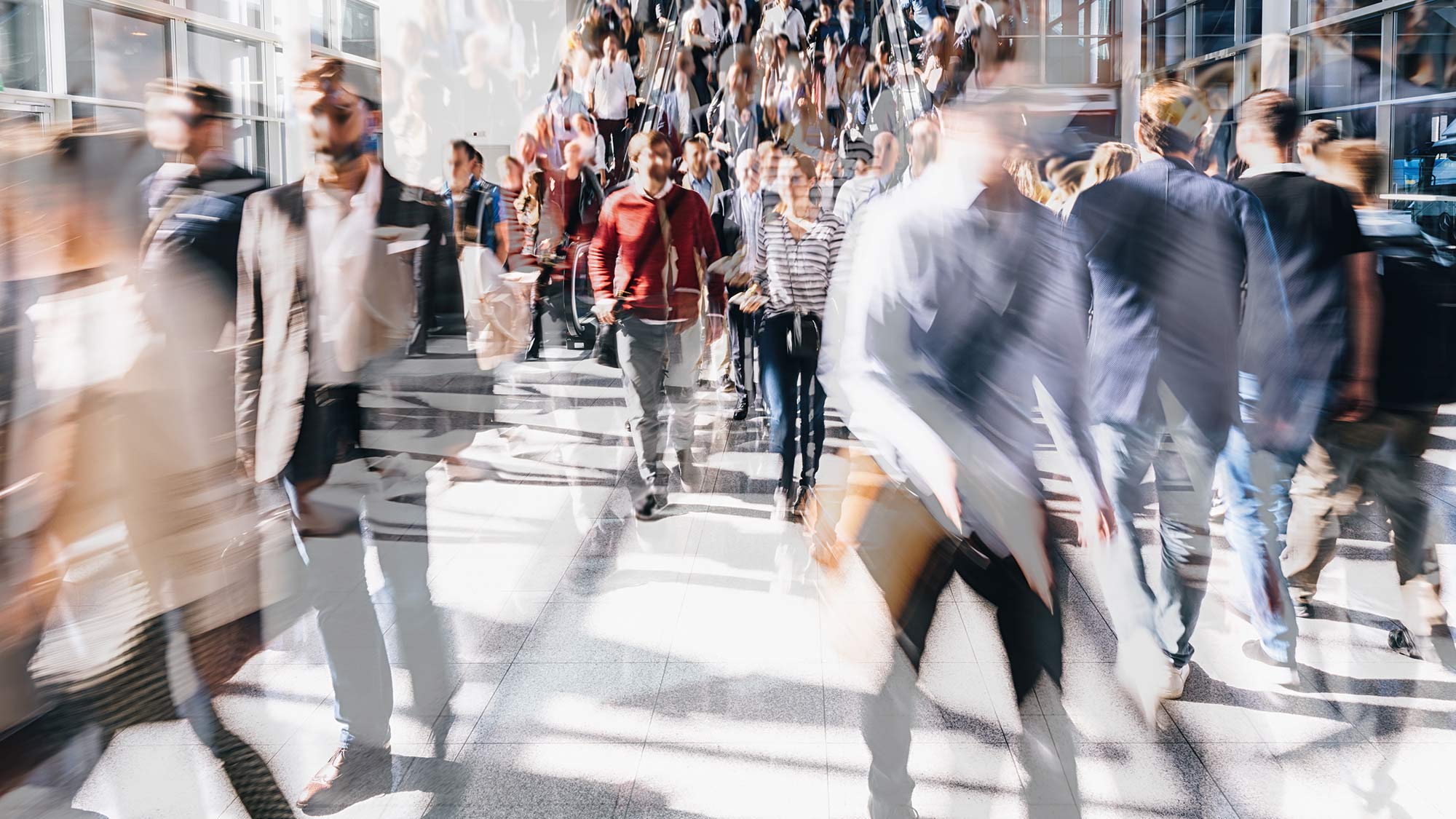 People moving through busy station