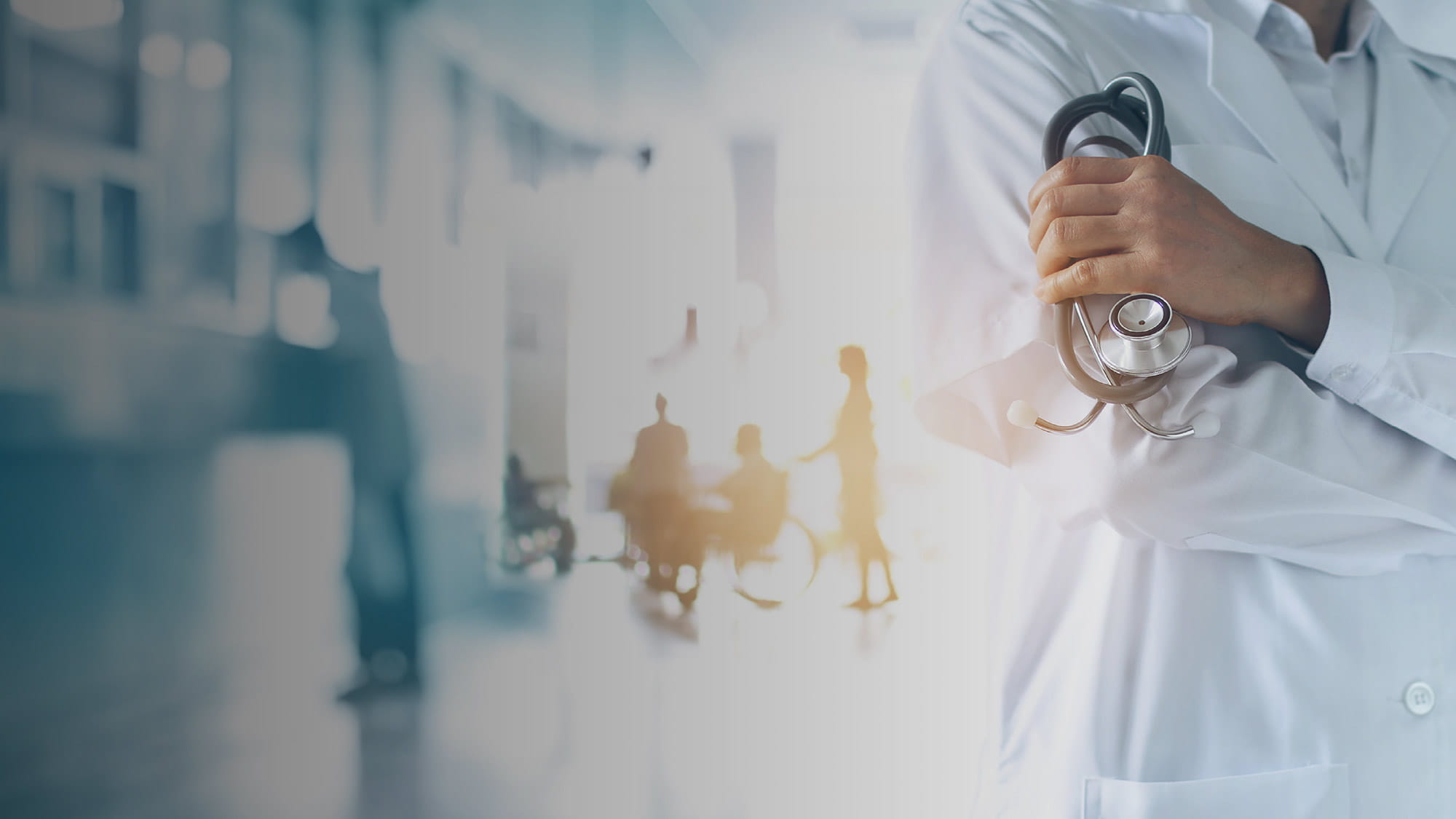 Doctor inside a hospital with stethoscope in hand and patients in the background
