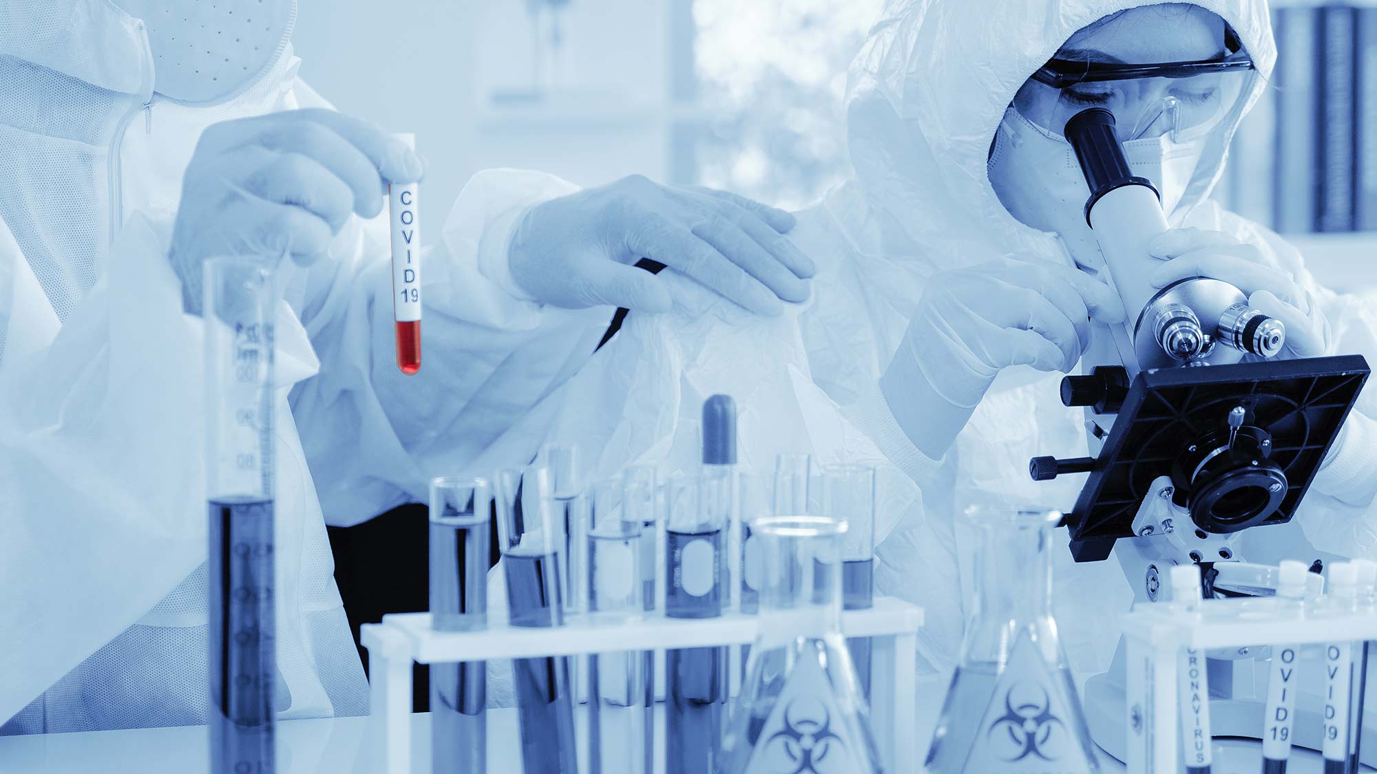 Scientists work in a laboratory focused on producing a vaccine