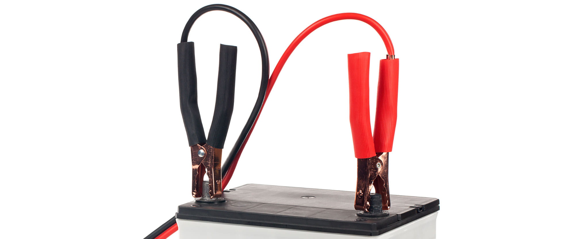Jumper cables attached to a car battery 