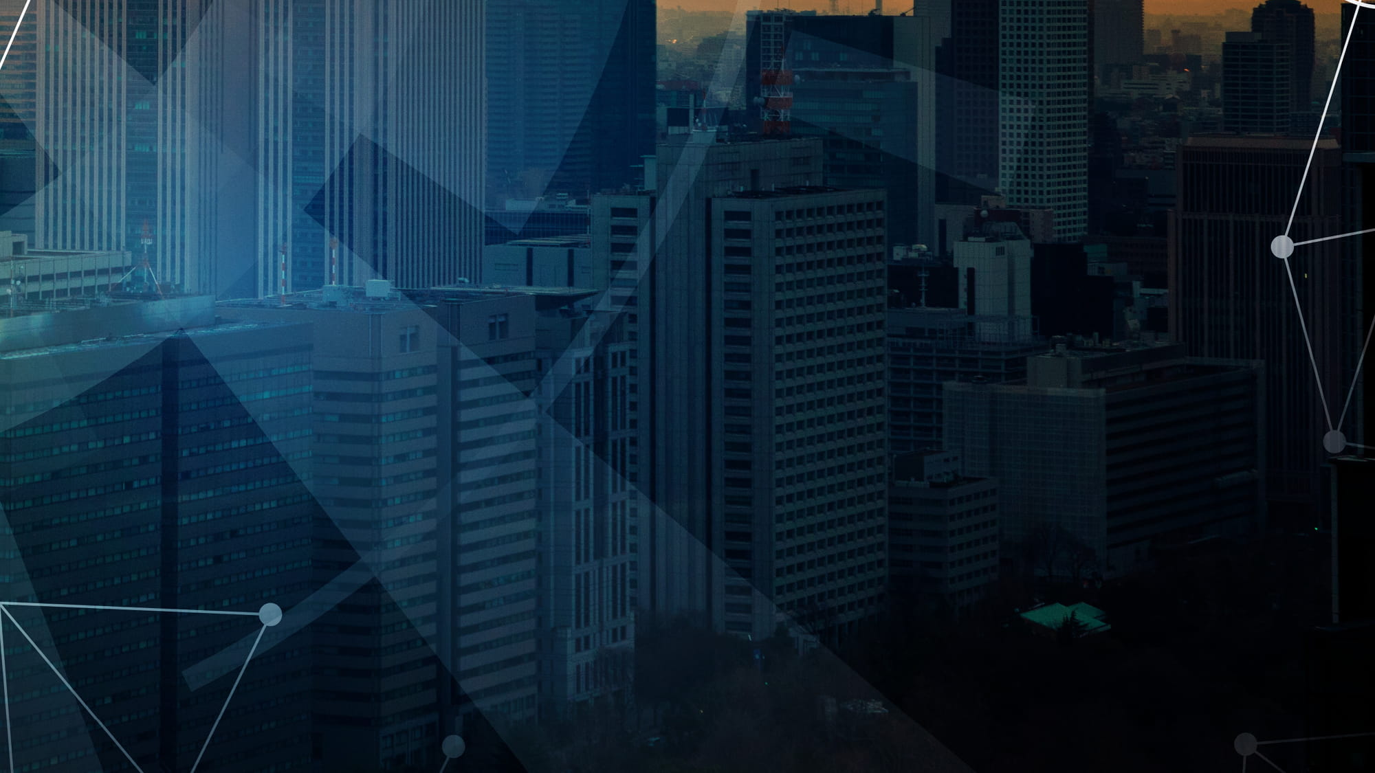 Image of city at dusk with graphics and lines overlaid to show connected assets