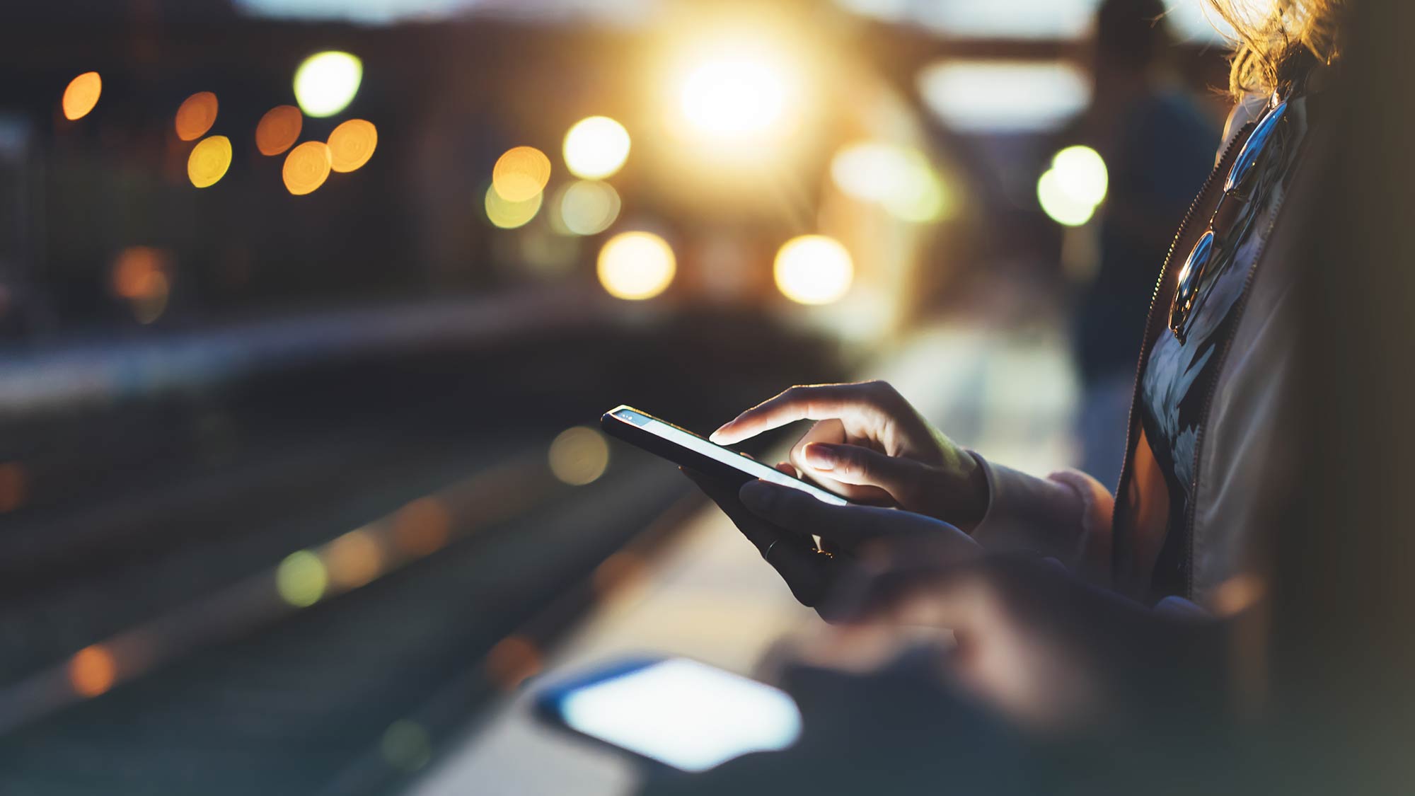 Man on mobile phone at a station