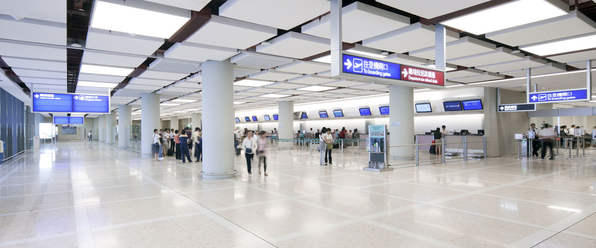Passengers inside the Sky Plaza terminal at Hong Kong International Airport