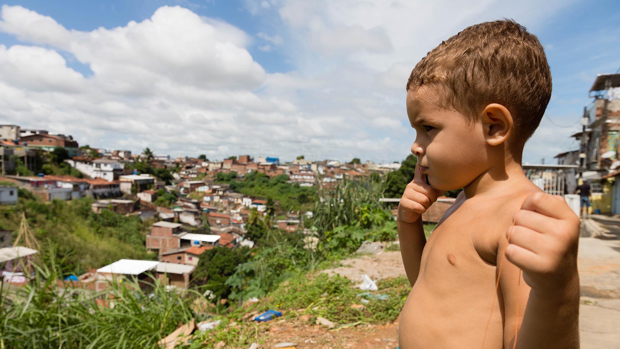 Child looking out onto city landscape