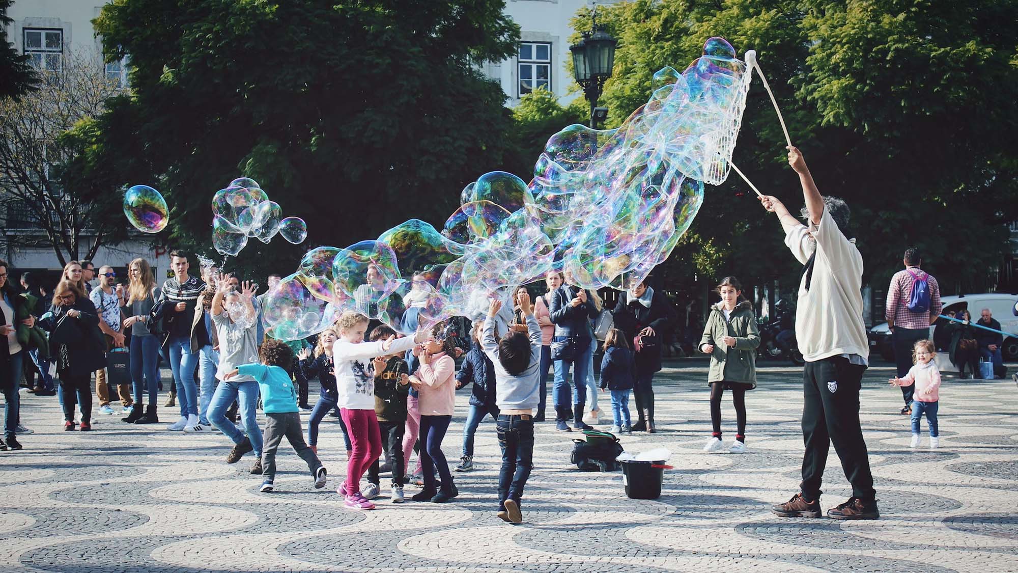 Children playing in a city. Unsplash