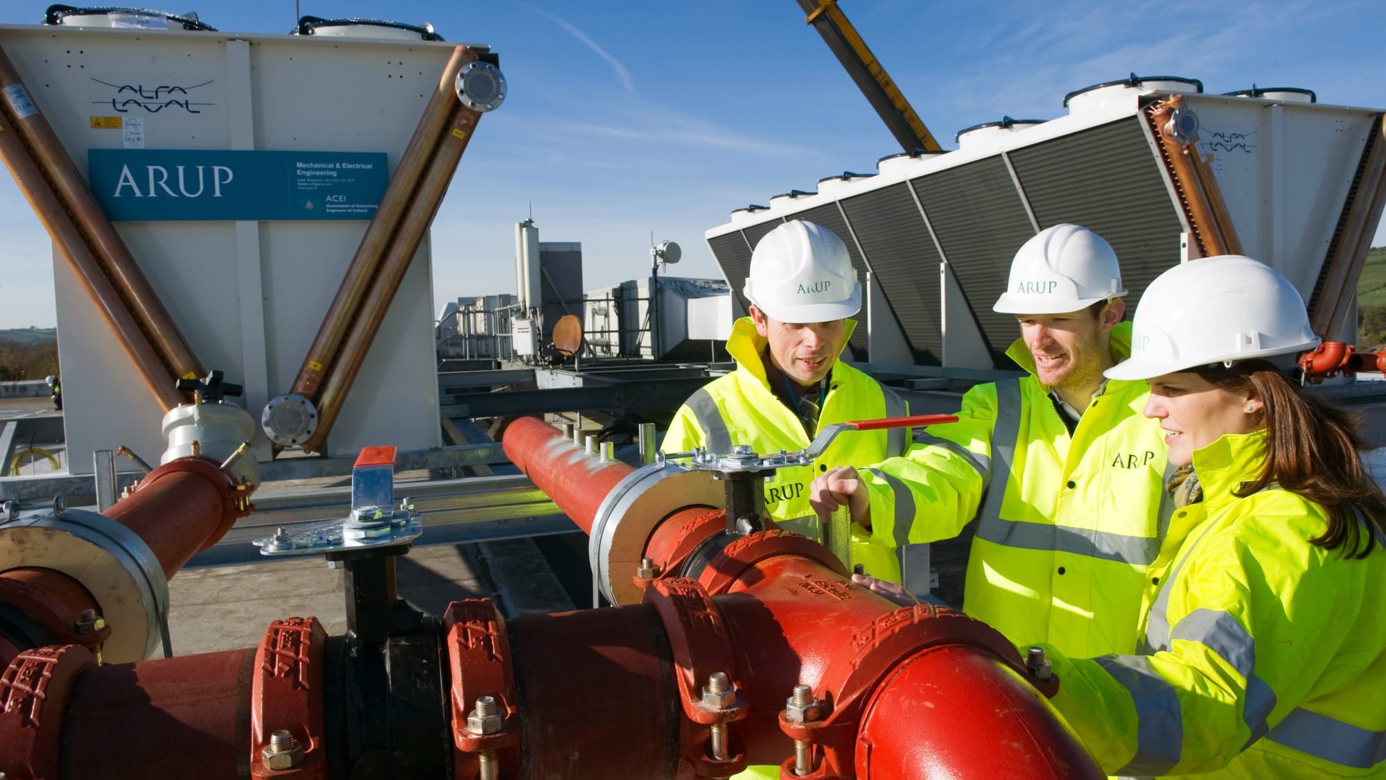 People wearing hard hats and hi-vis vests working on centre of excellence project.
