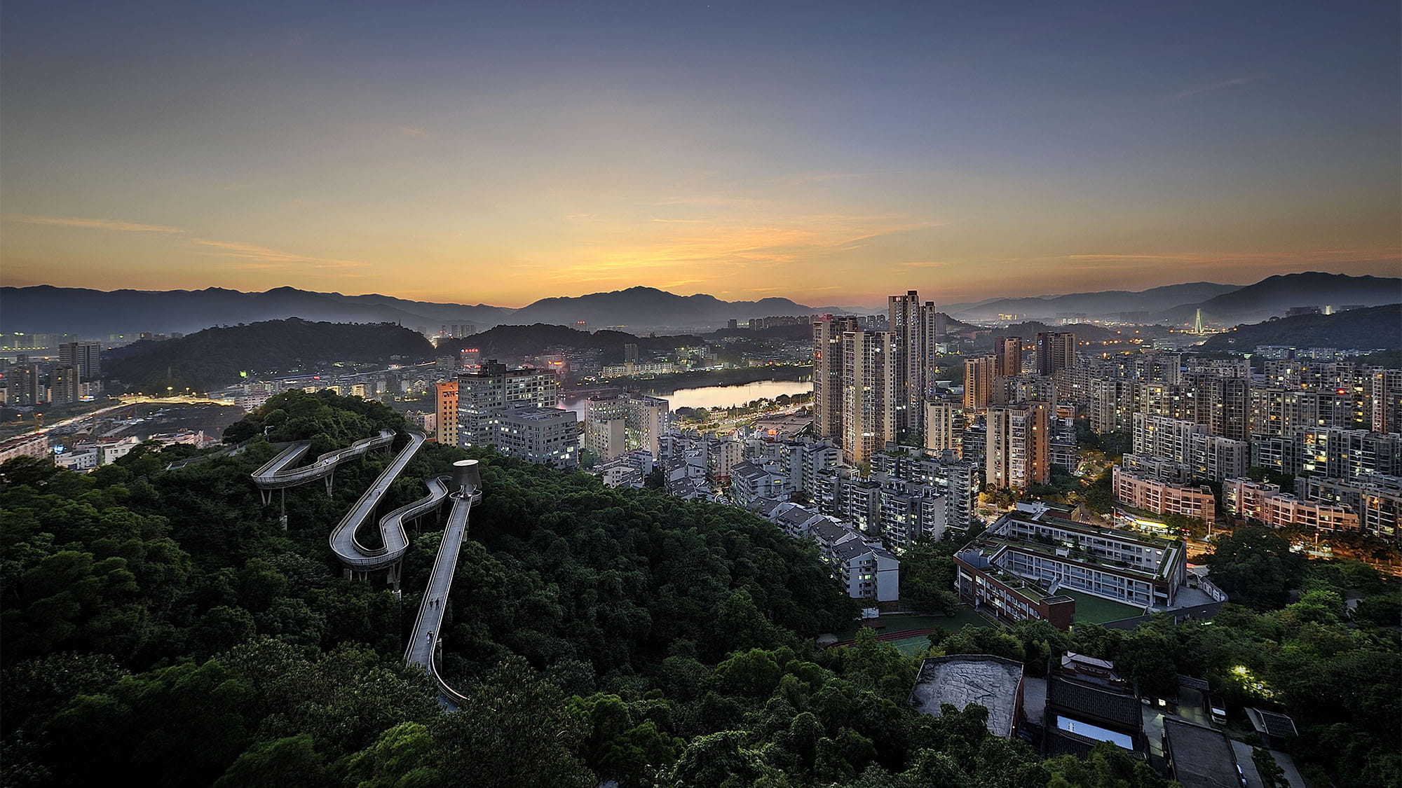 View of Fudao bride weaving through forested hills overlooking Fuzhou