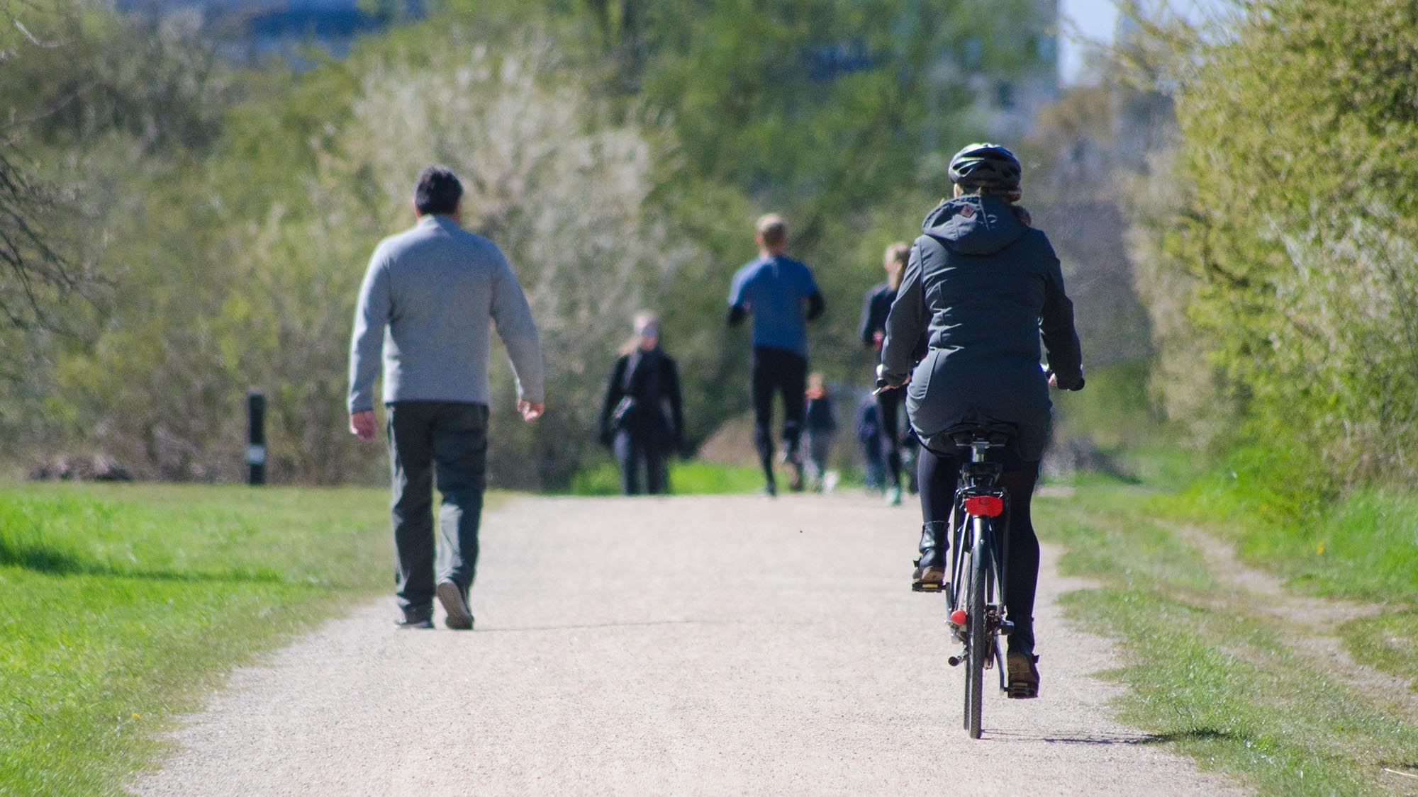 People walking and cycling in a city