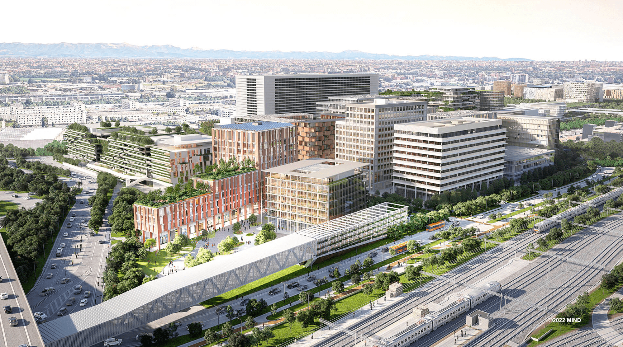 Buildings, streets, trees, and a rail line