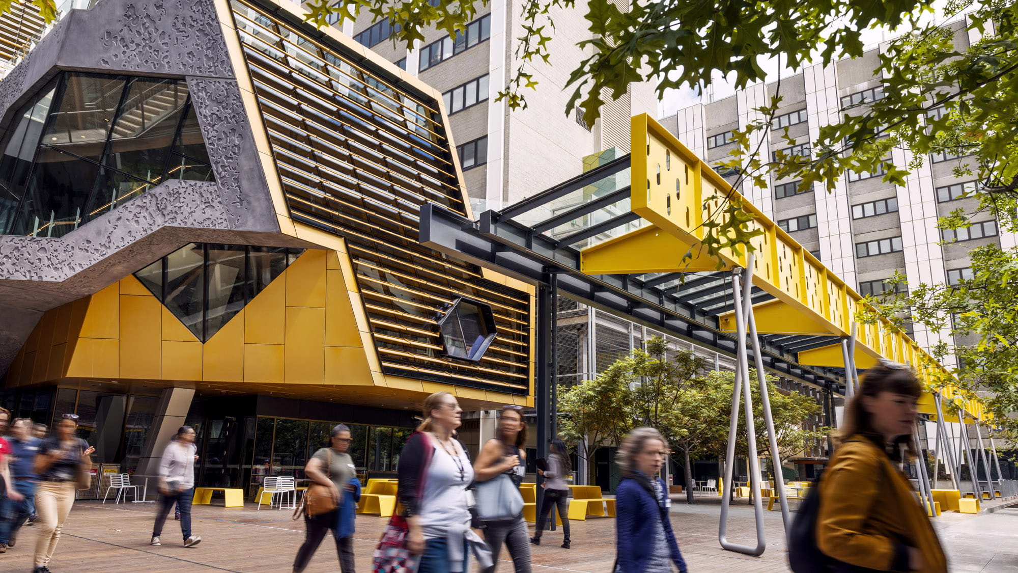 People walking in front of the new building