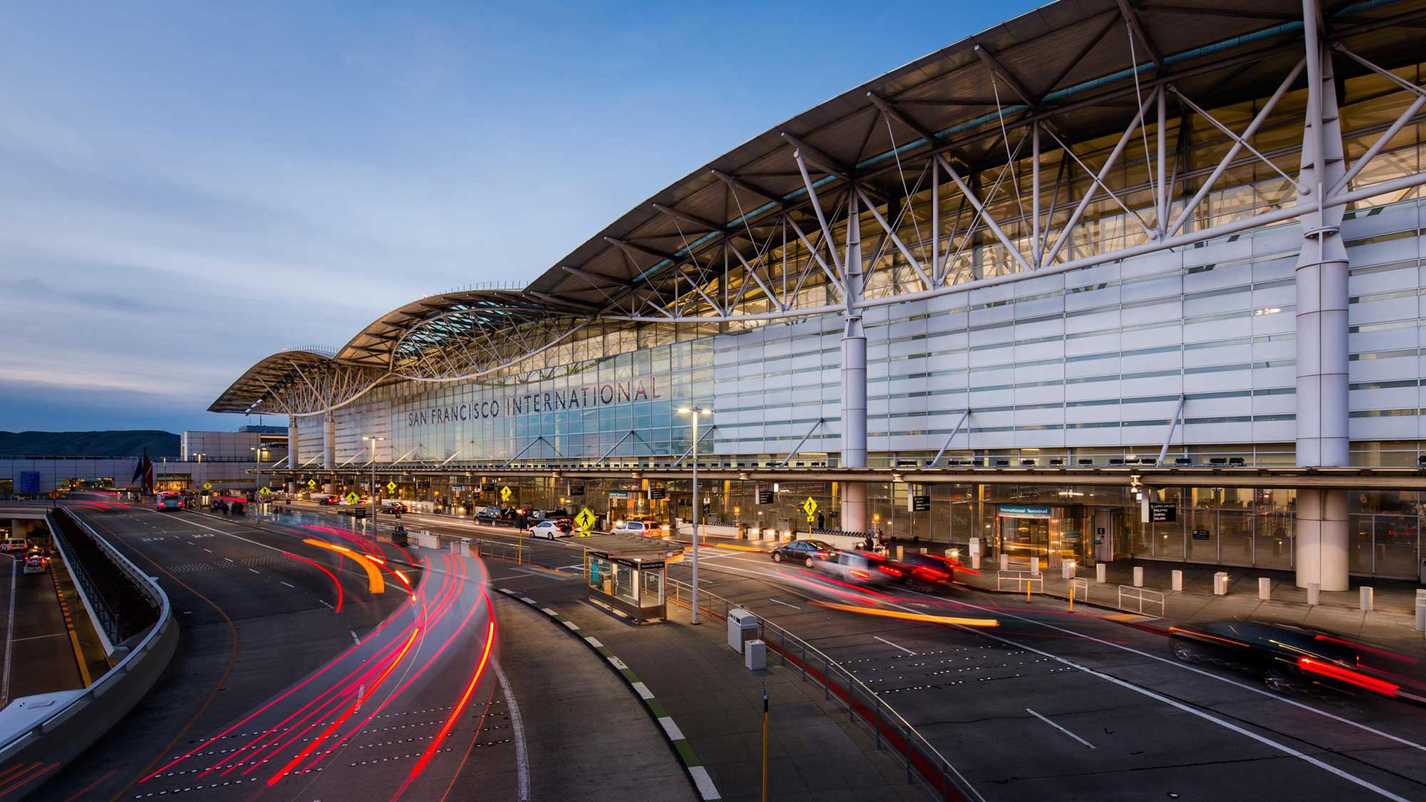 Cars traveling through the SFO roadway at dusk