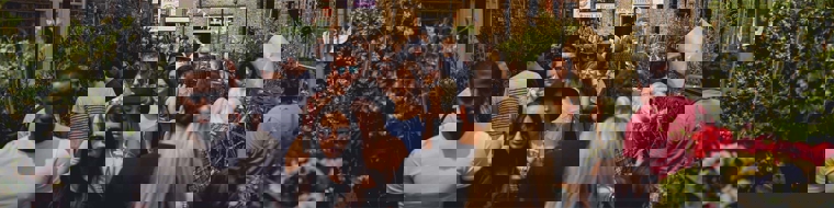 People walking down a busy street