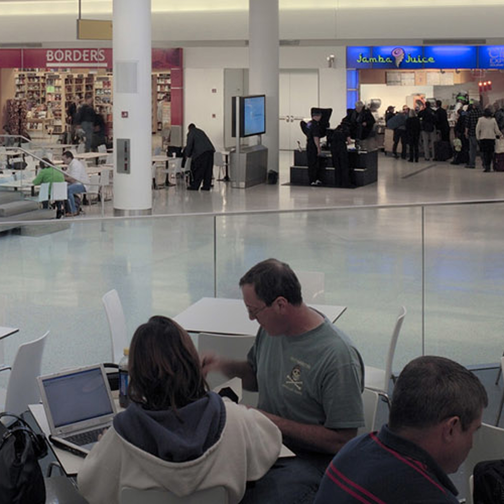 Passengers inside an airport terminal building