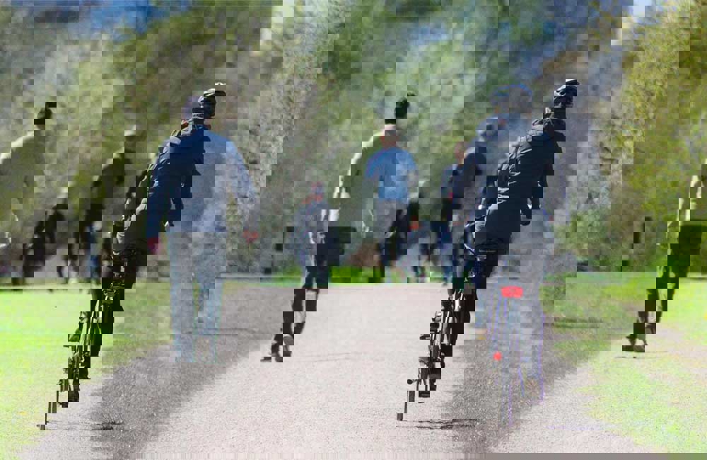 People walking and cycling along a path