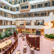 A large building with tables and chairs.