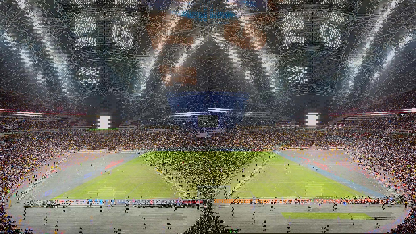 Singapore Stadium hosting football with the roof open