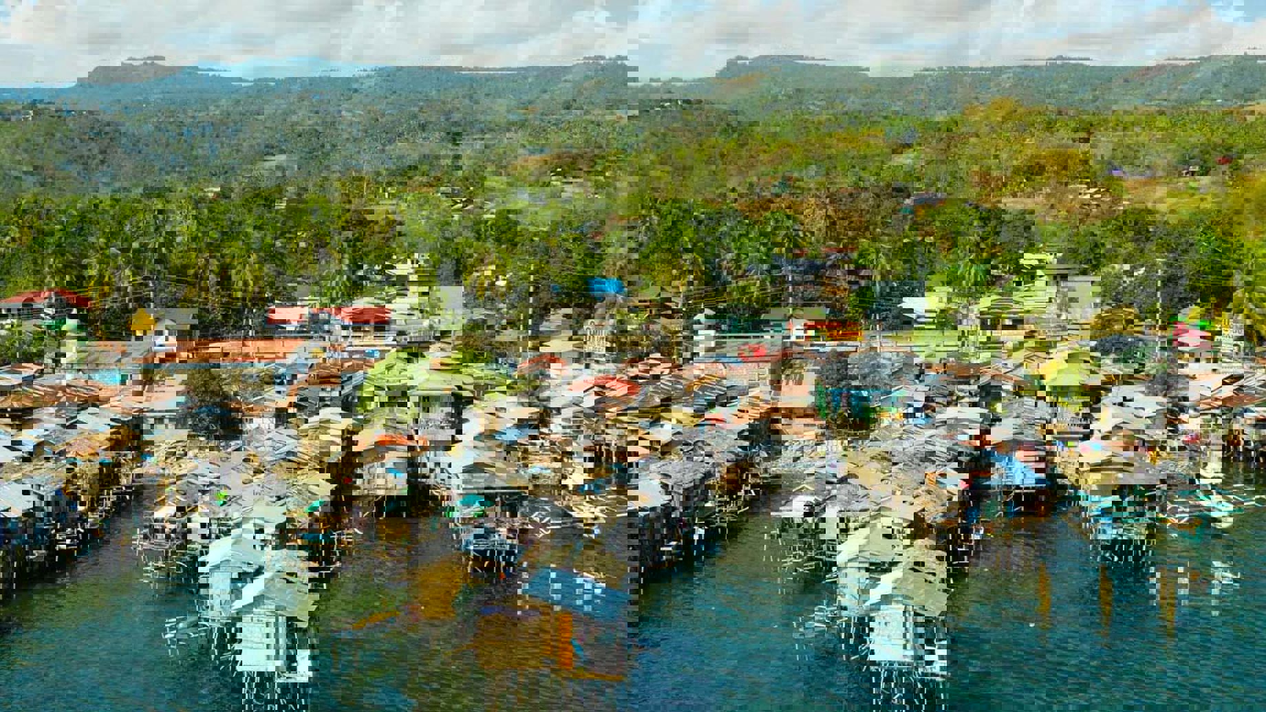 Wooden houses built on the river in a low socio-economic neighbourhood in an Asian city